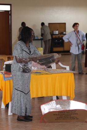 Faustine at the solar cooker workshop on 3/30/09.  Forty-three women returned home with a solar cooker that day!